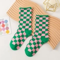 Pink and green checkerboard crew socks for women featuring ribbed green heels and toes - One Size / Pink & Green