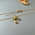 Polished gold M-letter pendant necklace with adjustable chain on minimalist background - O-Chain Single Chain