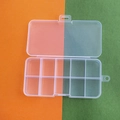 Detailed top view of 10-compartment transparent plastic storage box on a dual-tone background - 10 Fixed Compartments with Integrated Latch (12.8*6.5*2.2cm)