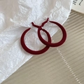 Detailed view of red velvet C-shaped hoop earrings on a textured white surface - Red Velvet Large Hoop (39# Silver Pin)