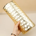 Macro shot of gold heart quilted nail arm rest showing metallic PU leather texture - Semicircle Heart Nail Pillow Gold