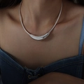 Minimalist silver snake chain necklace with curved crescent pendant on a model - Steel Color Necklace-40cm / Silver