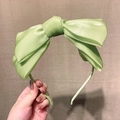 Elegant pale green satin headband with a large bow design for women's hair styling - Light Green