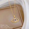 Detailed view of evil eye pendant with blue crystal and white rhinestones on gold chain - Evil Eye Eyelash Pendant Style (E518)
