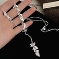 Minimalist silver leaf tassel necklace for women featuring fine metallic pendants - Metal Leaf Pendant Necklace