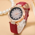 Macro detail of wine red leather strap and rhinestone flower dial on rose gold watch - Watch Only / Red