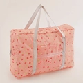 Pink travel bag with cherry and floral prints, featuring durable handles and side storage - Pink Cherry
