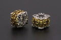 Macro detail of two-tone retro hollow metal bead with vintage pattern for DIY jewelry - Vajra / 11x11mm