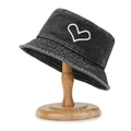Faded black washed denim bucket hat with white heart embroidery on wooden display stand - Heart Embroidery Black