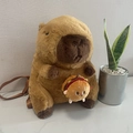 Cute brown capybara plush backpack for kids with a small burger charm and brown straps - Capybara Burger Style / 35cm