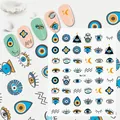Detail of bohemian evil eye nail art stickers featuring blue eye and hamsa patterns - Me134