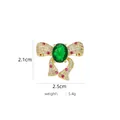 Detail view of a gold bow brooch with a large green emerald and pink stones, 2.5cm size - B790 Green/Large Bow