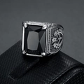 Detail of vintage silver ring with black square gemstone and side relief carving - Number 7 / Black