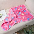 Pink fleece pet blanket with heart and paw prints on a cozy cream sofa setting - Pink Paw Heart