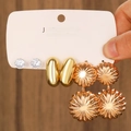 Close-up of golden earring set with zircon studs and textured sunburst drops - KC Gold Polished (5186)