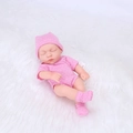 20cm sleeping reborn baby doll in pink polka dot romper and matching hat on white plush - Dark Pink Polka Dot