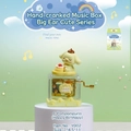 Boîte à musique à manivelle avec figurine chien jaune et gâteau sur socle transparent - Anniversaire de Pompompurin