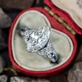 Vintage marquise cut diamond ring with blue sapphire accents in a red velvet heart box - US 6 / White Gold