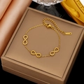 18K gold plated stainless steel bracelet featuring infinity twisted rope links on jewelry box - Gold Stainless Steel Infinity Bracelet (SLE2240)