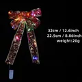 Red Christmas ribbon bow with gold stars and built-in LED lights, size 32x22.5cm - Red / Multicolor Light