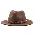 Close-up of brown straw fedora hat featuring a studded faux leather band and woven texture - M (56-58cm) / Brown