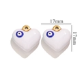 Detail view of a 17mm white heart earring charm with a blue evil eye design and gold loop - Gold White Evil Eye Heart