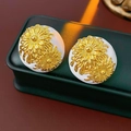 Macro detail of vintage round floral earrings with 3D sunflower pattern on jewelry box - Silver Earring Post-White