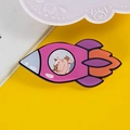Cute cartoon rocket brooch with cow pilot design in pink and purple colors - 05 Rocket Cow