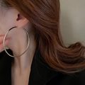 Model wearing large minimalist silver hoop earrings with a smooth polished metallic finish - 25# Silver Minimalist Glossy Large Hoop (Silver Earring Post)