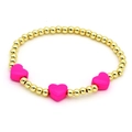 Detail view of golden beaded bracelet with three magenta heart-shaped charms on white background - Plum Red