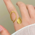 Polished 18K gold stainless steel open ring with a teardrop geometric lava drop design - 18K Gold Asymmetric Drop (6031)