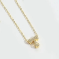 Golden necklace with letter T pendant featuring sparkling cubic zirconia stones - Letter T