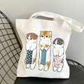 White canvas tote bag featuring three cute cartoon cats printed on the front surface - Cat with Towel