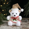 White flocked polar bear Christmas ornament with brown hat and red ribbon bow, 21cm height - 21x14cm