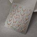 Makroaufnahme von 3D-Weihnachts-Nagelaufklebern mit bunten Strasssteinen und Girlandenmustern - Weihnachten Französischer Stil (CO-493)