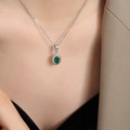 Vintage Thai style silver necklace with oval green gemstone pendant on female model - Necklace / Silver Color Green Zirconia / 40+5cm