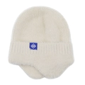 Detail of white plush knitted earflap hat with soft texture and blue snowflake label - Beige