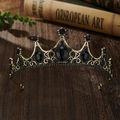 Macro detail of vintage bronze crown with black crystals on dark wooden background - Bronze Base Black Zirconia