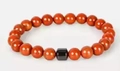 Red beaded 8mm stone bracelet with a single black geometric accent bead for men - Red Sesame