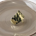 Detailed macro view of hammered golden texture on a minimalist metallic hair clip - Narrow Edge Gold