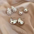 Set of six silver oval C-shaped stud earrings in polished metal on satin fabric - 35# Silver Pin (6-Piece Set) / Silver