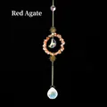 Bohemian gold sun catcher featuring red agate stones and a crystal moon pendant - Red Agate
