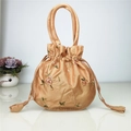Champagne gold satin drawstring bucket bag with pink floral embroidery and top handles - Champagne Gold