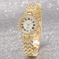 Detail of gold women's quartz watch with Roman numerals and rhinestone-encrusted metal band - Gold Single Watch