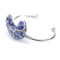 Handmade silver wire-wrapped moon bangle featuring natural blue sodalite stone - Blue Sodalite