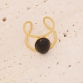 Detail of a golden double-layered hollow ring with a black oval gemstone on stone surface - Black Oval Gemstone Style (3#)