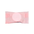Portable compressed face towel in pink candy-style single wrapper for travel use - Single Round Pink Bag