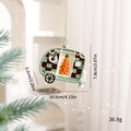Light green Christmas camper ornament with red plaid roof and gold string hanging on tree - Green Camper Van