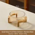 Amber glass fruit bowl with cross bamboo stand, 21cm size in a cozy home setting - 1800ML / Small Amber (Bamboo Stand)