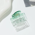 Close-up of transparent green square hair claw clip with spring on white background - Square Green
